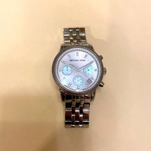 Michael Kors. Silver Watch. Fits 6.5 inch wrist.